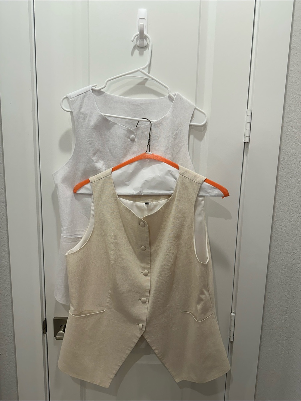 One Cream and One white Sleeveless Button Front Vest Top